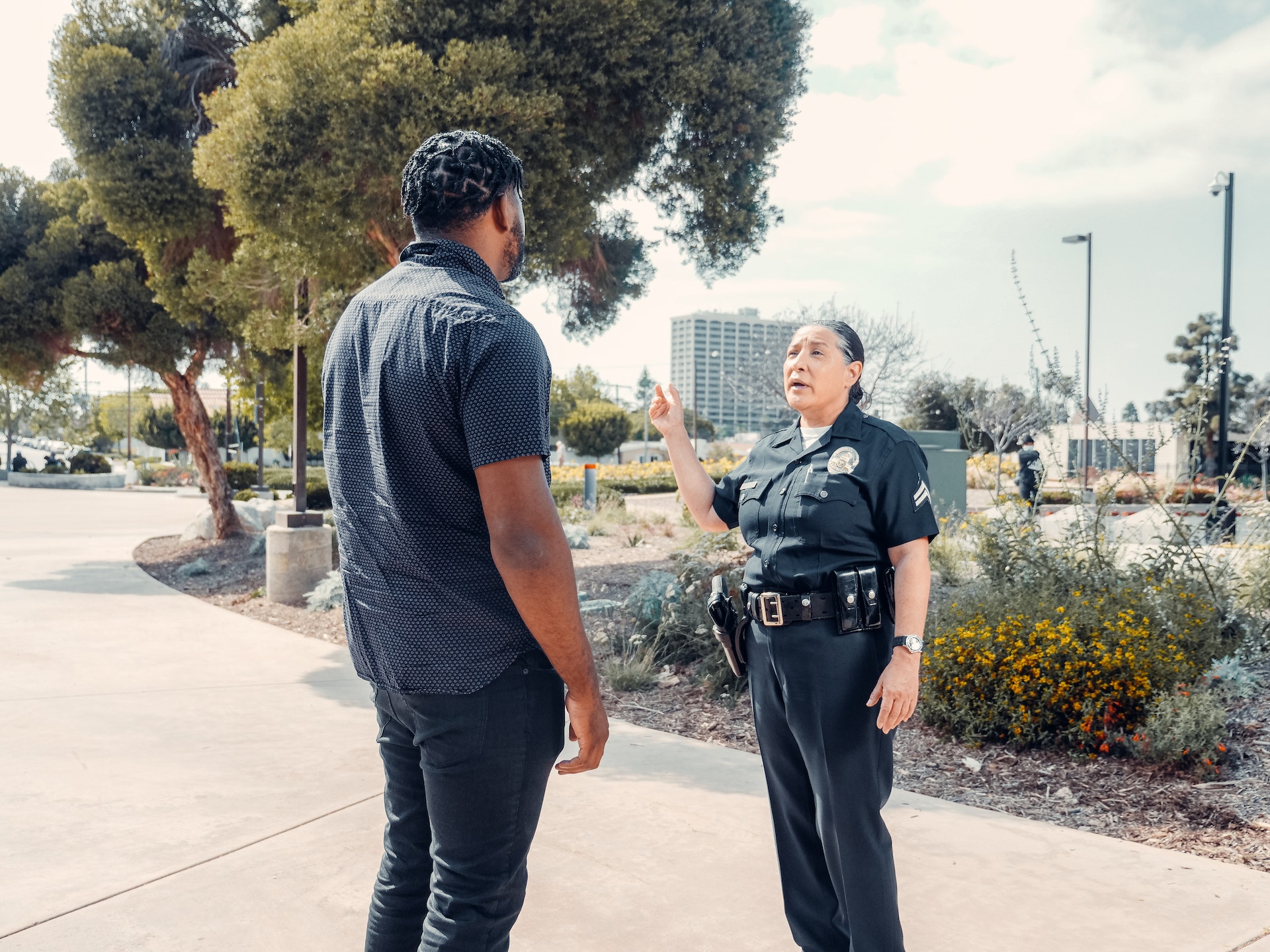 Photo by Kindel Media: https://www.pexels.com/photo/police-officer-talking-to-man-in-black-shirt-on-the-street-7714762/