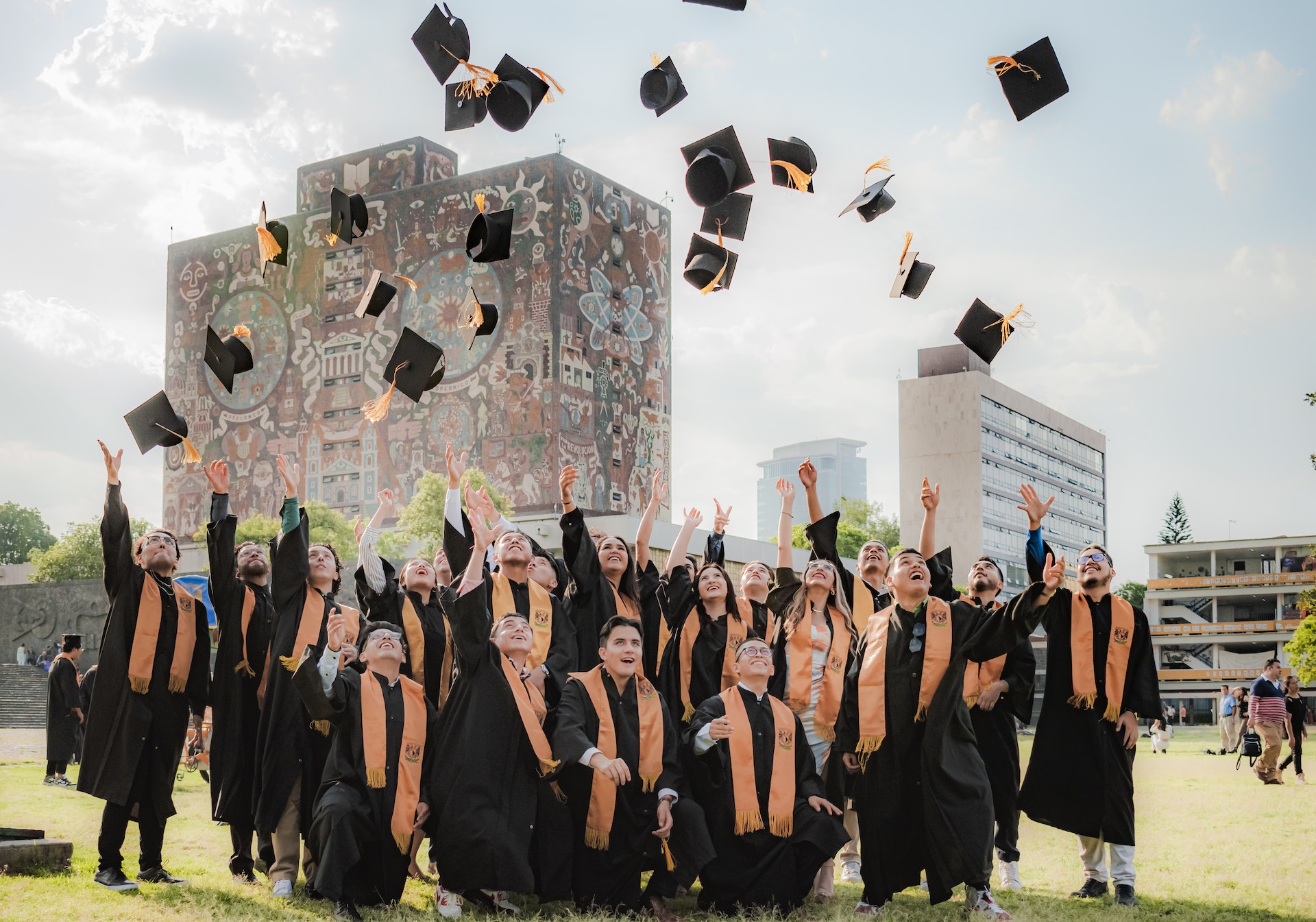 Photo by Ulises Peña: https://www.pexels.com/photo/smiling-graduates-throwing-up-academic-hats-near-unam-central-library-building-17615704/