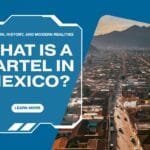 Aerial view of a Mexican city at sunset with mountains in the background, used as a cover image for an article titled “What Is a Cartel in Mexico?” about the definition, history, and modern realities of organized crime in Mexico.