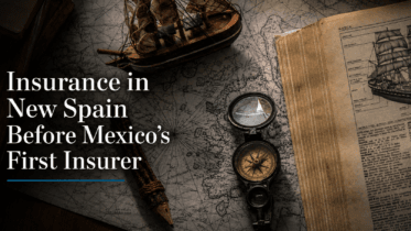Antique map, compass, model ship and open book with the title “Insurance in New Spain Before Mexico’s First Insurer.”